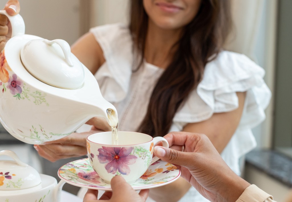 Waldorf Astoria Atlanta Buckhead - ‘In Full Bloom’ Dogwood Tea, tea being poured from a tea pot into a tea cup with saucer